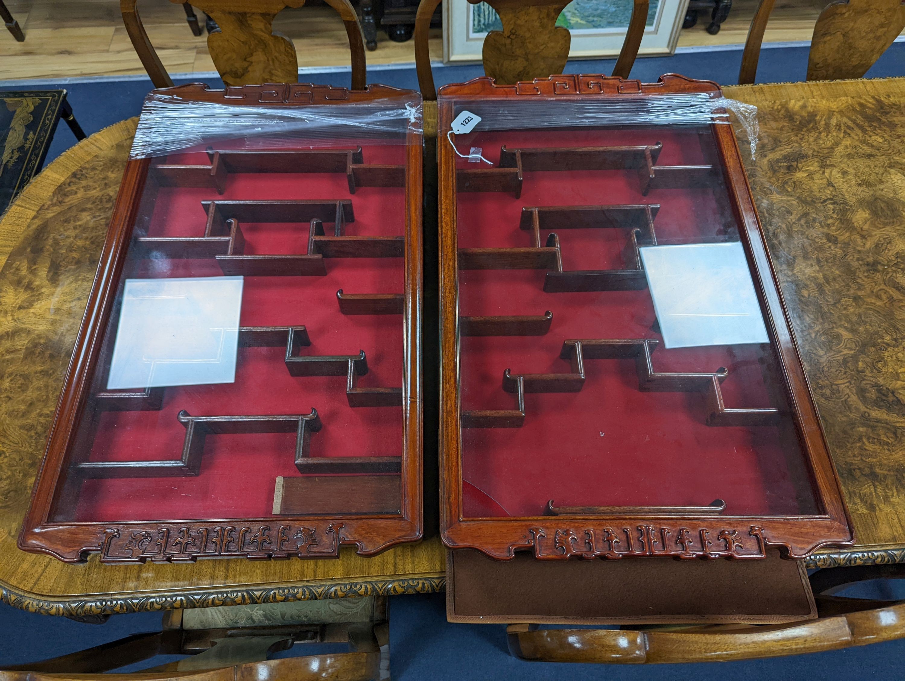 A pair of Chinese hardwood snuff bottle cabinets, width 50cm, depth 83cm